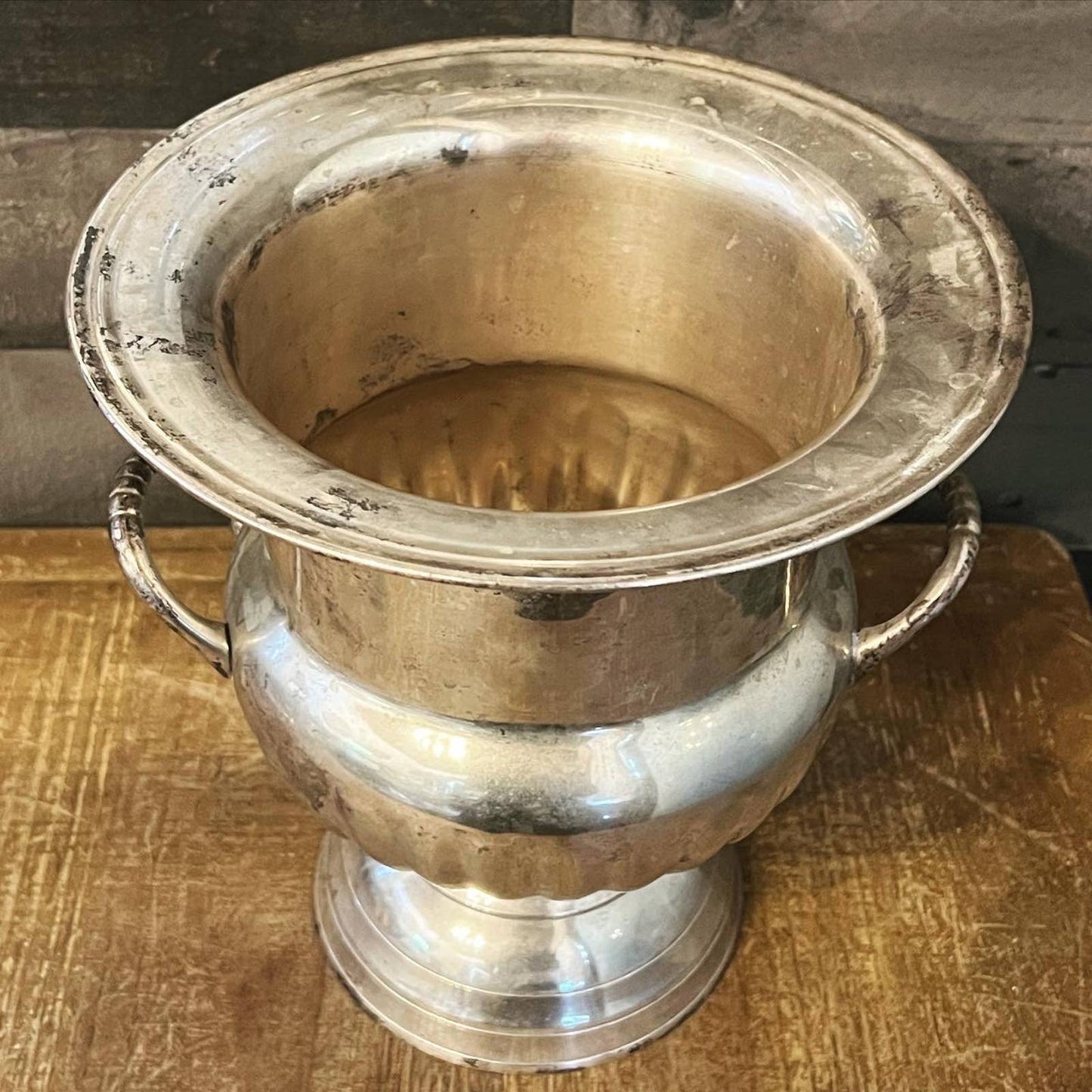 Vintage silver toned handled champagne / wine bottle chiller on a pedestal