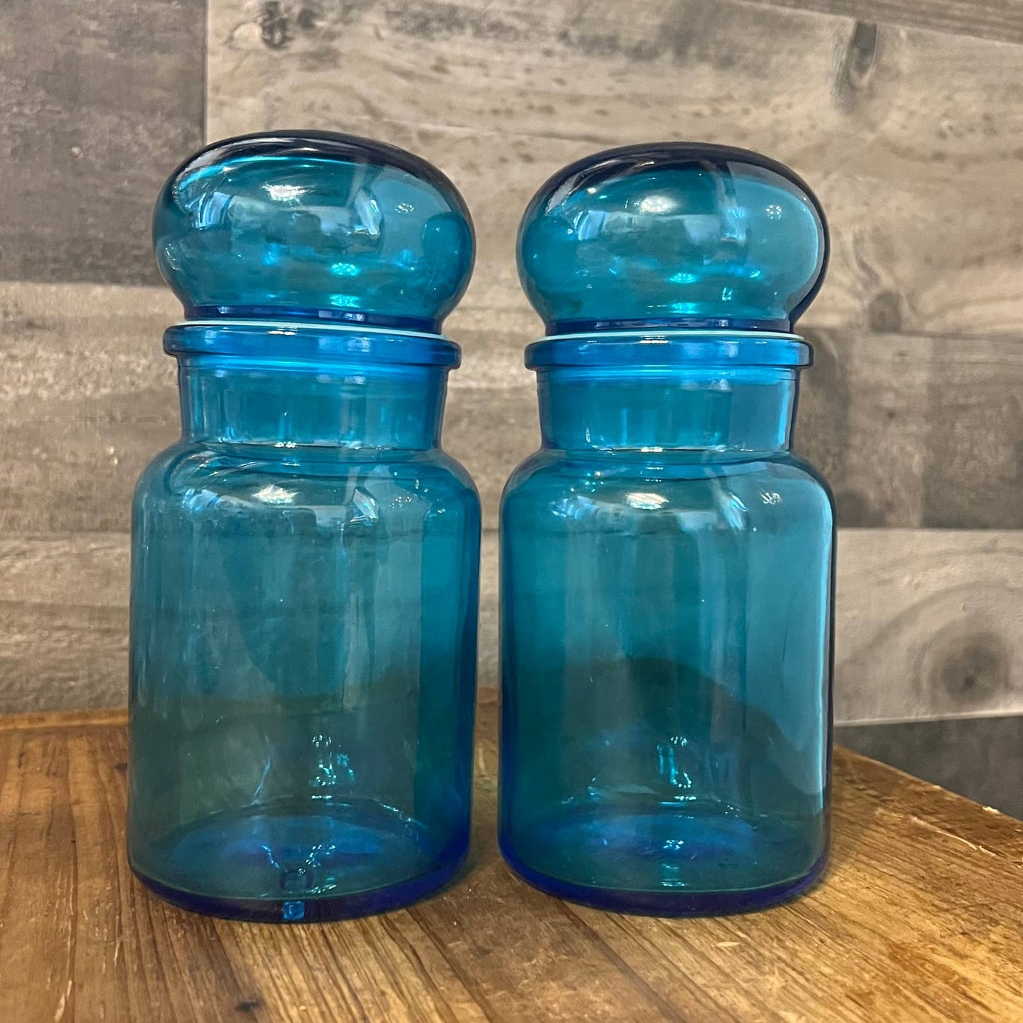 Pair of vintage MCM blue glass bubbly lid apothecary bottles