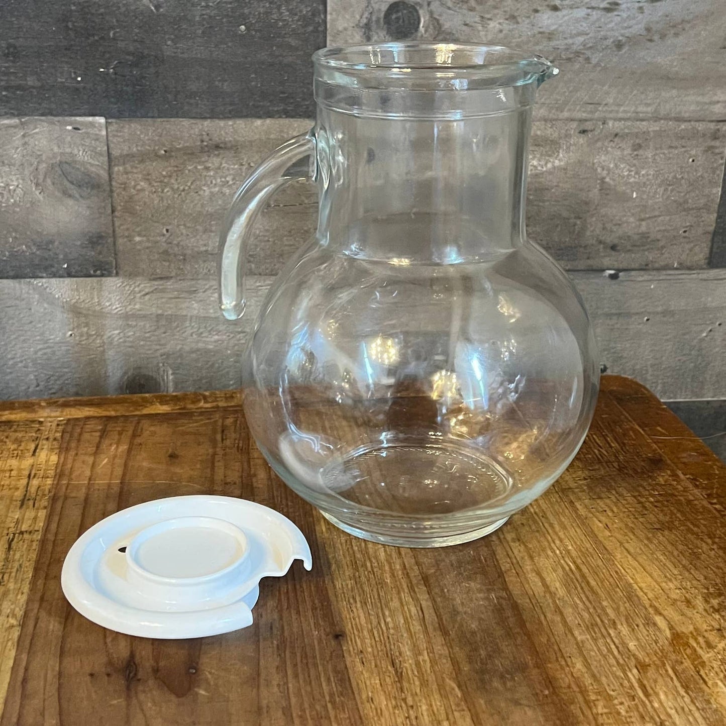 Vintage clear glass pitcher with white plastic lid