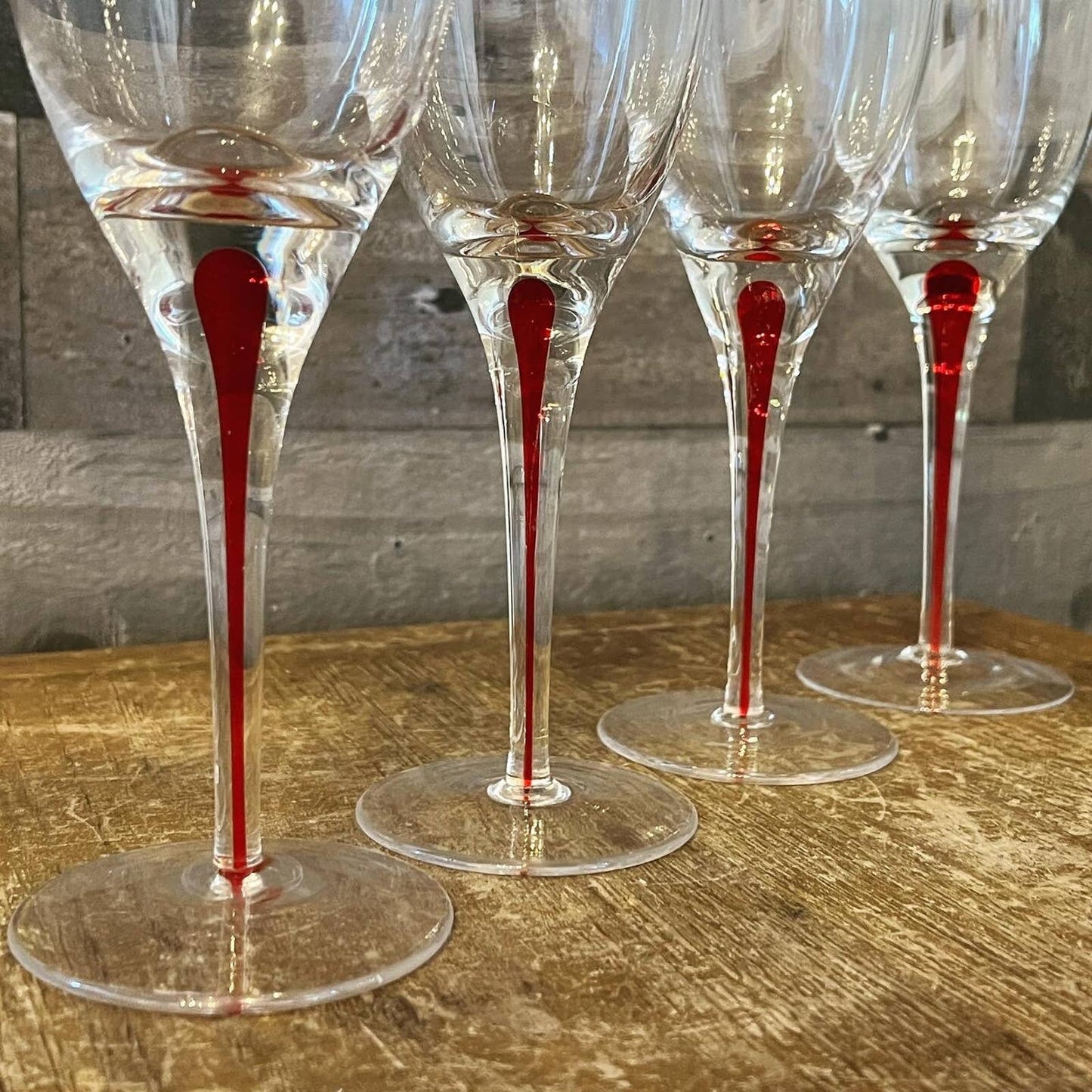 Set of 4 red teardrop long stem clear glass wine glasses