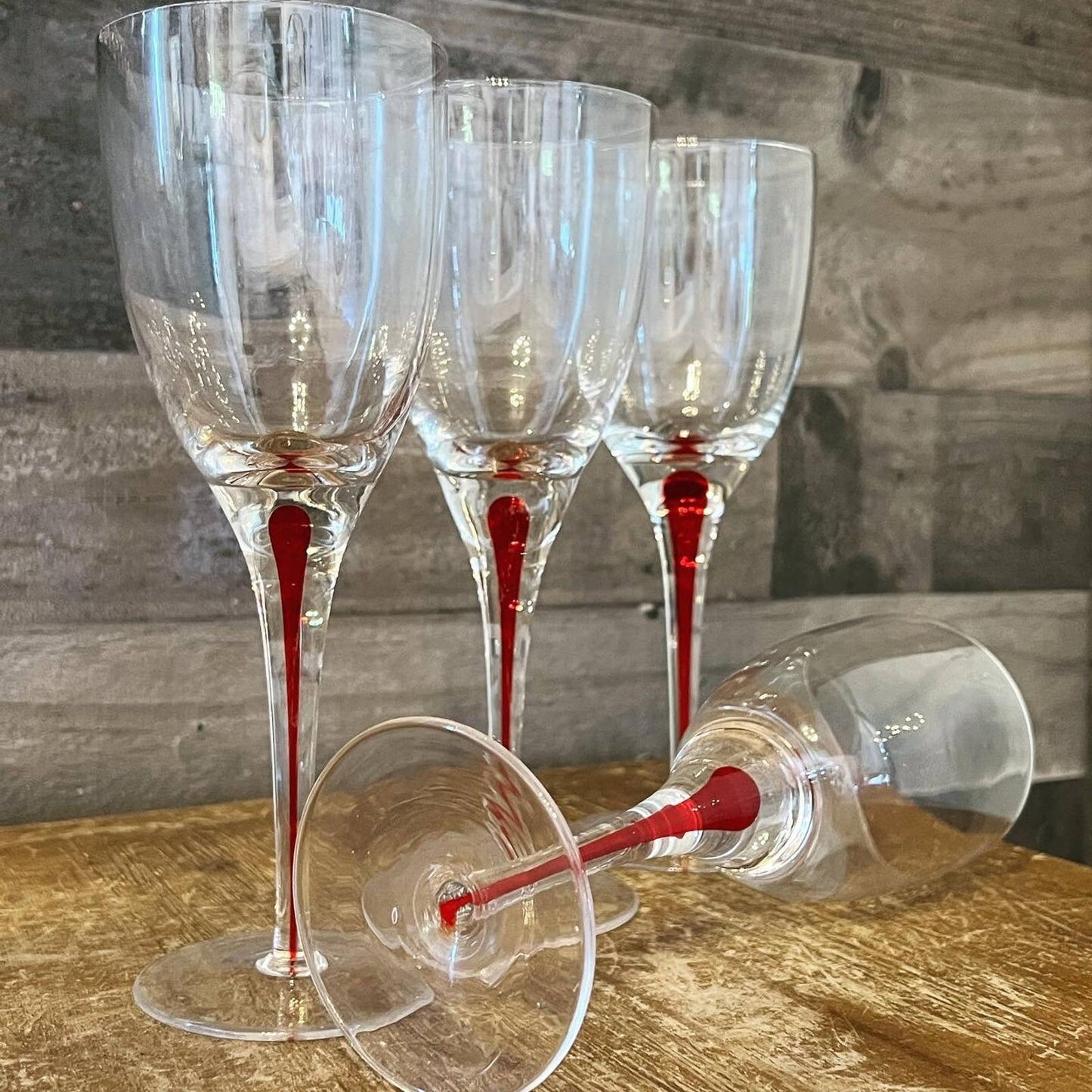 Set of 4 red teardrop long stem clear glass wine glasses