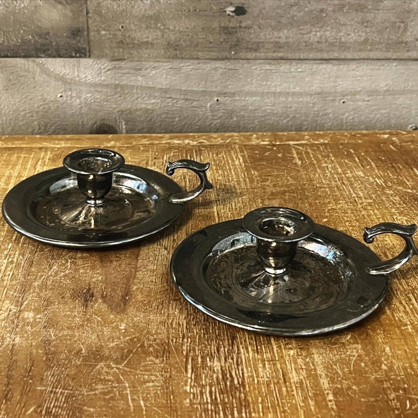 Vintage pair of aged silver tone candlestick holders - chamberstick