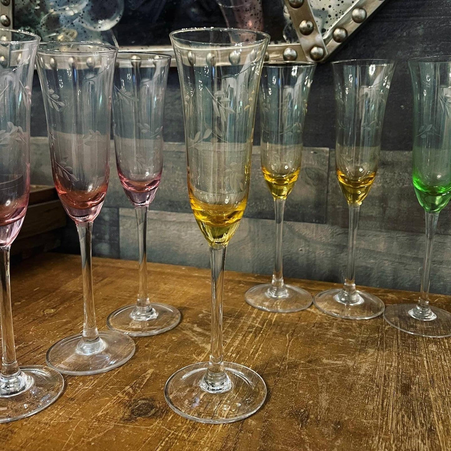 Multi color etched leaf crystal champagne flutes - pink, yellow, green, blue with champagne glasses