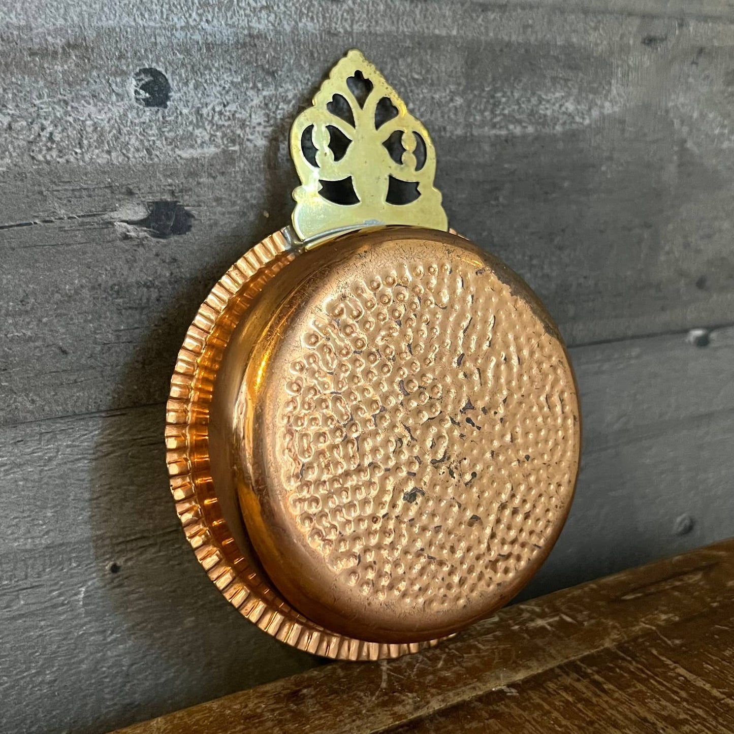 Vintage hammered copper trinket tray with brass handle