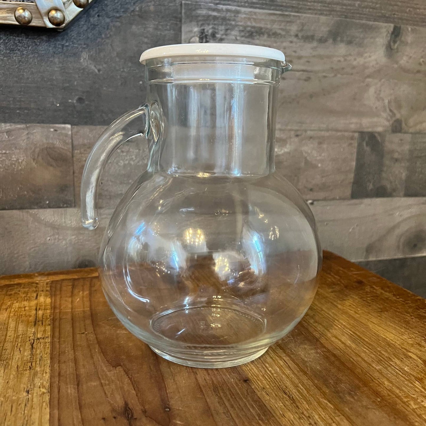 Vintage clear glass pitcher with white plastic lid