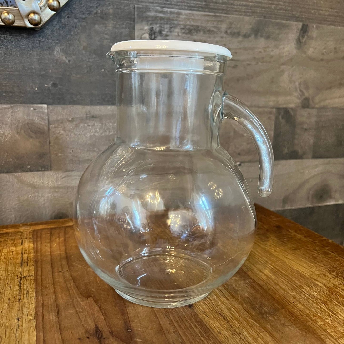 Vintage clear glass pitcher with white plastic lid