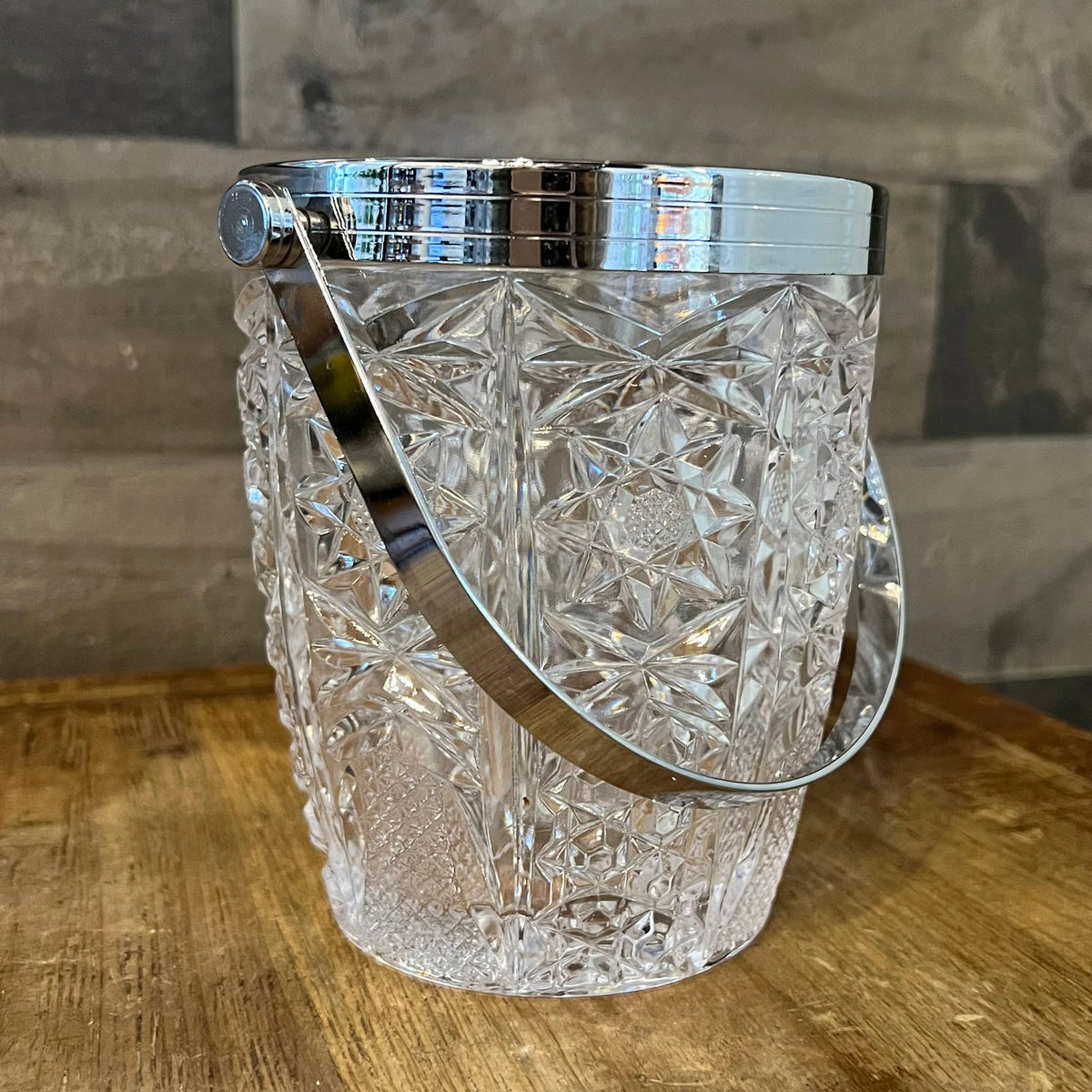 Vintage crystal ice bucket with chrome rim and handle