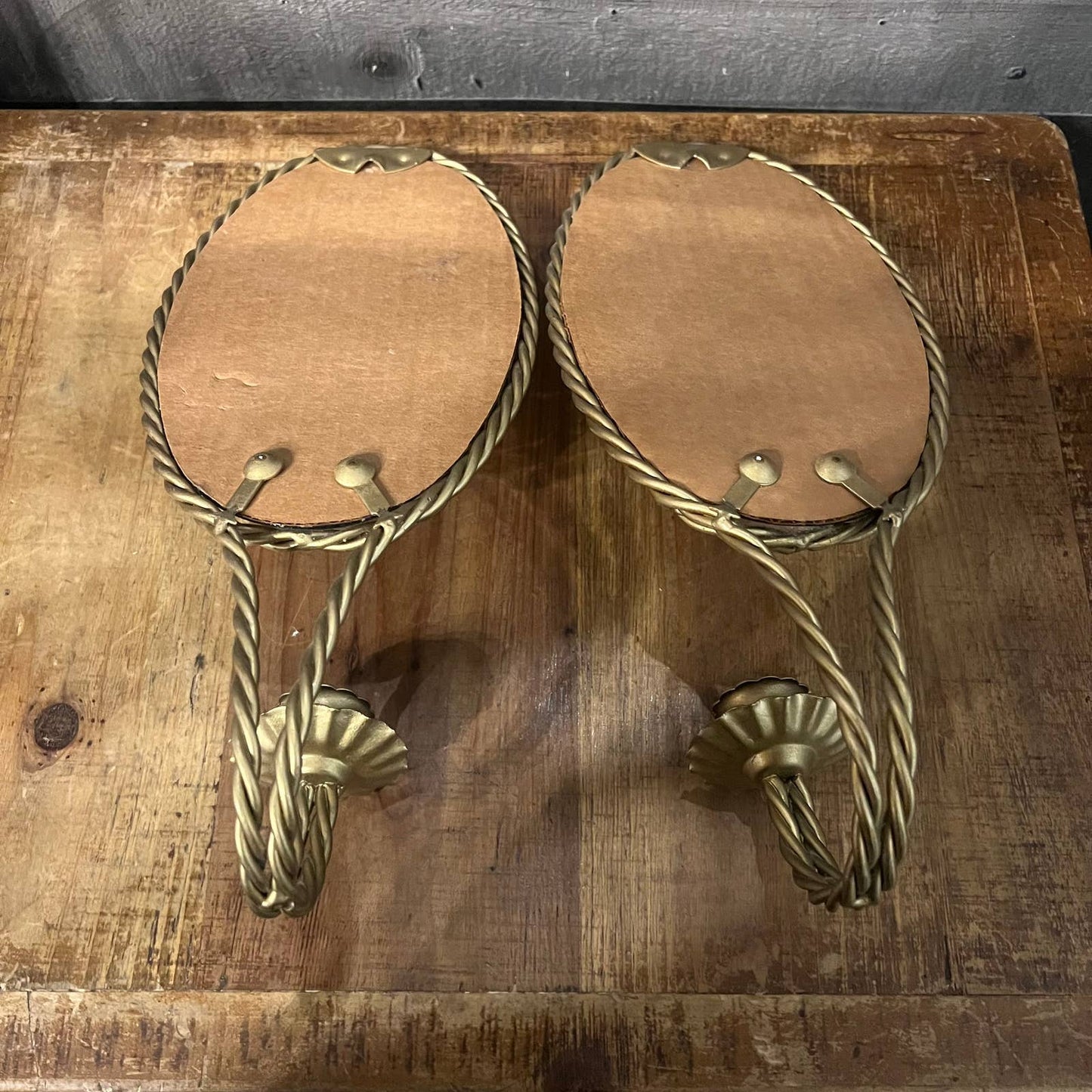 Vintage pair of gold braid mirrored candlestick wall sconces