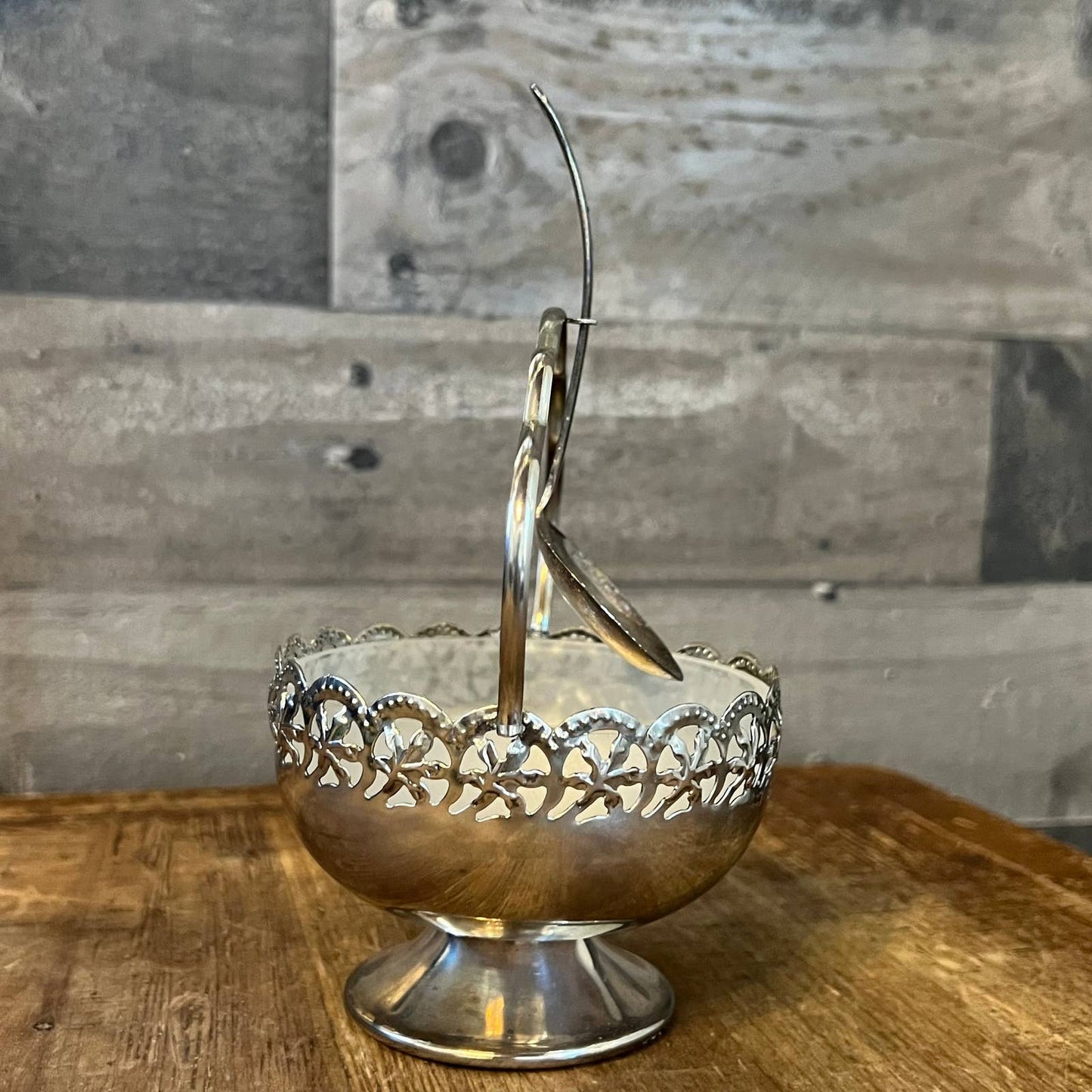 Vintage silver plated basket shaped footed sugar bowl with scalloped handle and spoon
