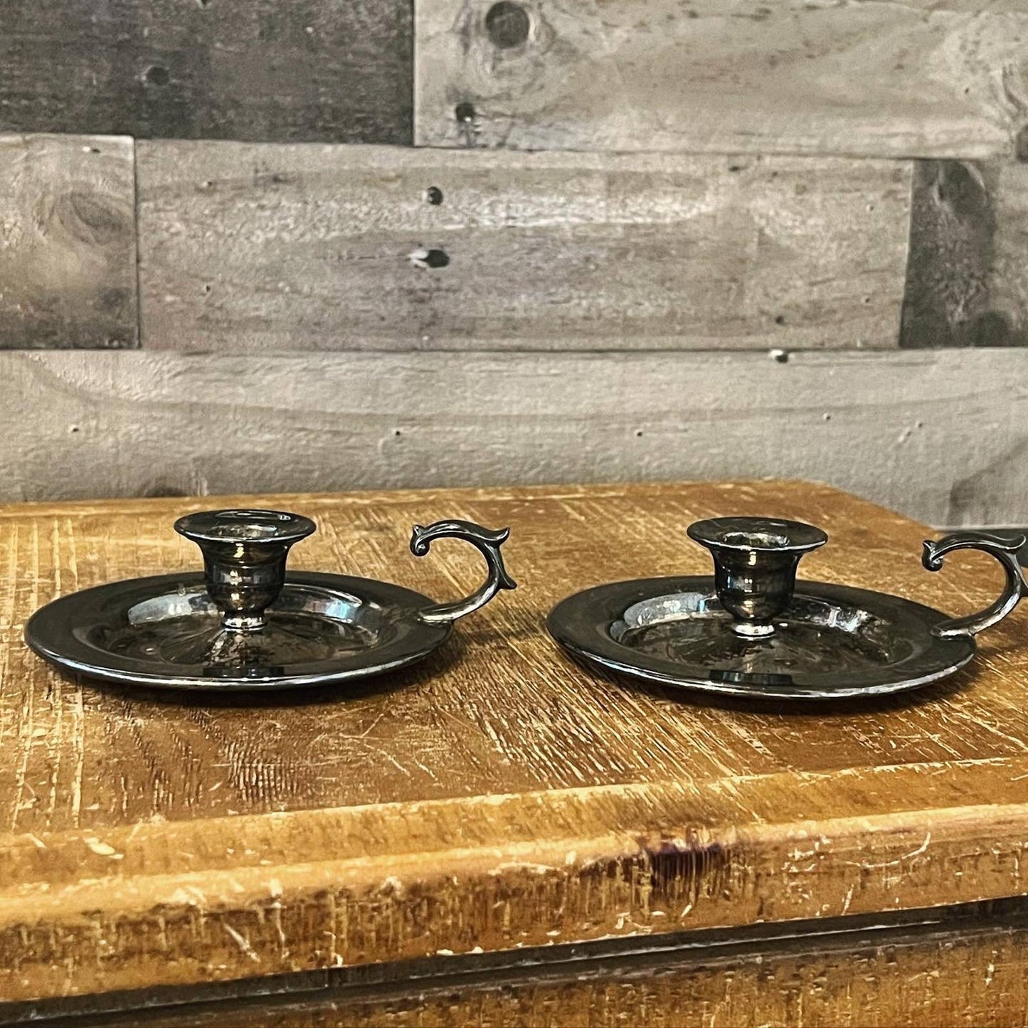 Vintage pair of aged silver tone candlestick holders - chamberstick