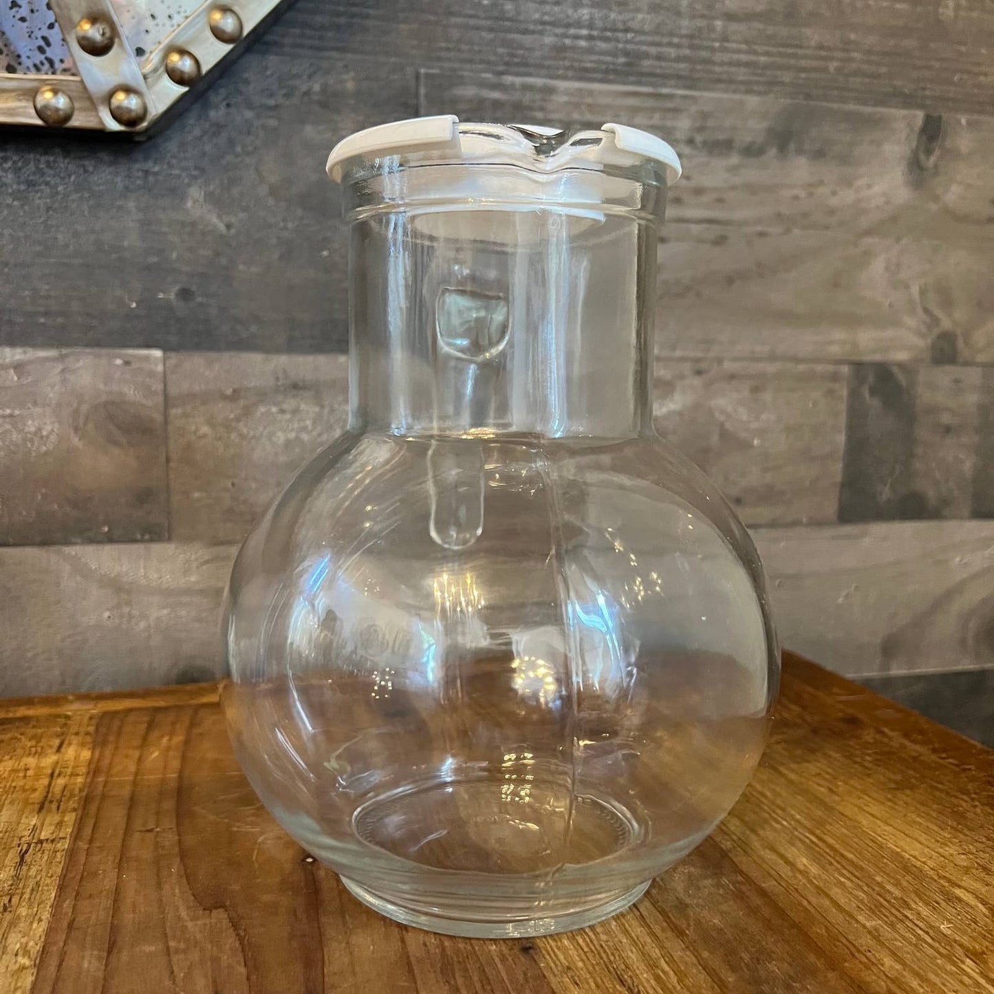 Vintage clear glass pitcher with white plastic lid