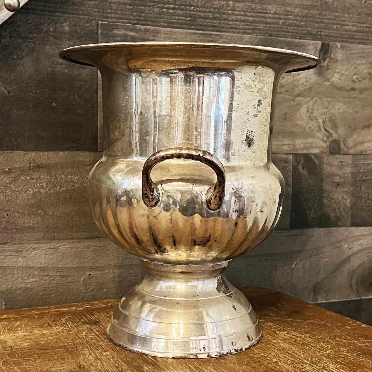 Vintage silver toned handled champagne / wine bottle chiller on a pedestal