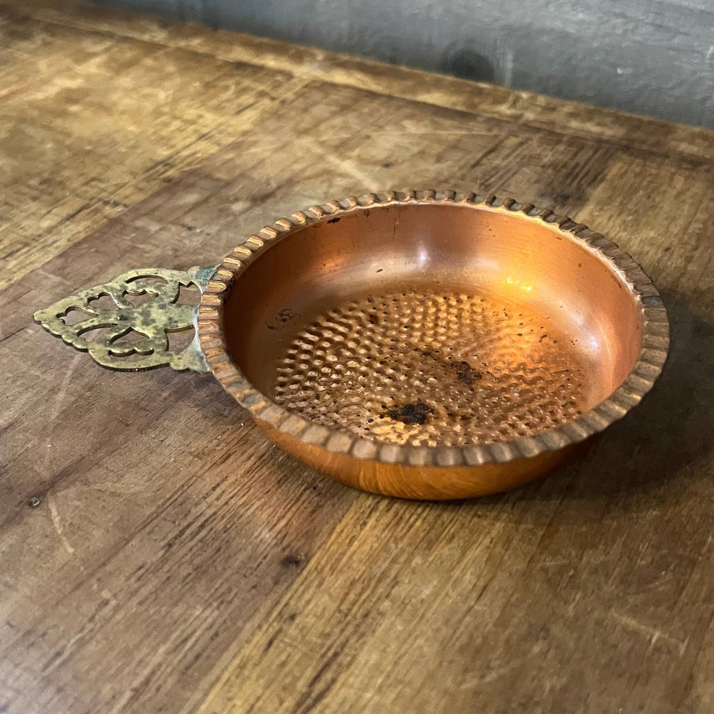 Vintage hammered copper trinket tray with brass handle
