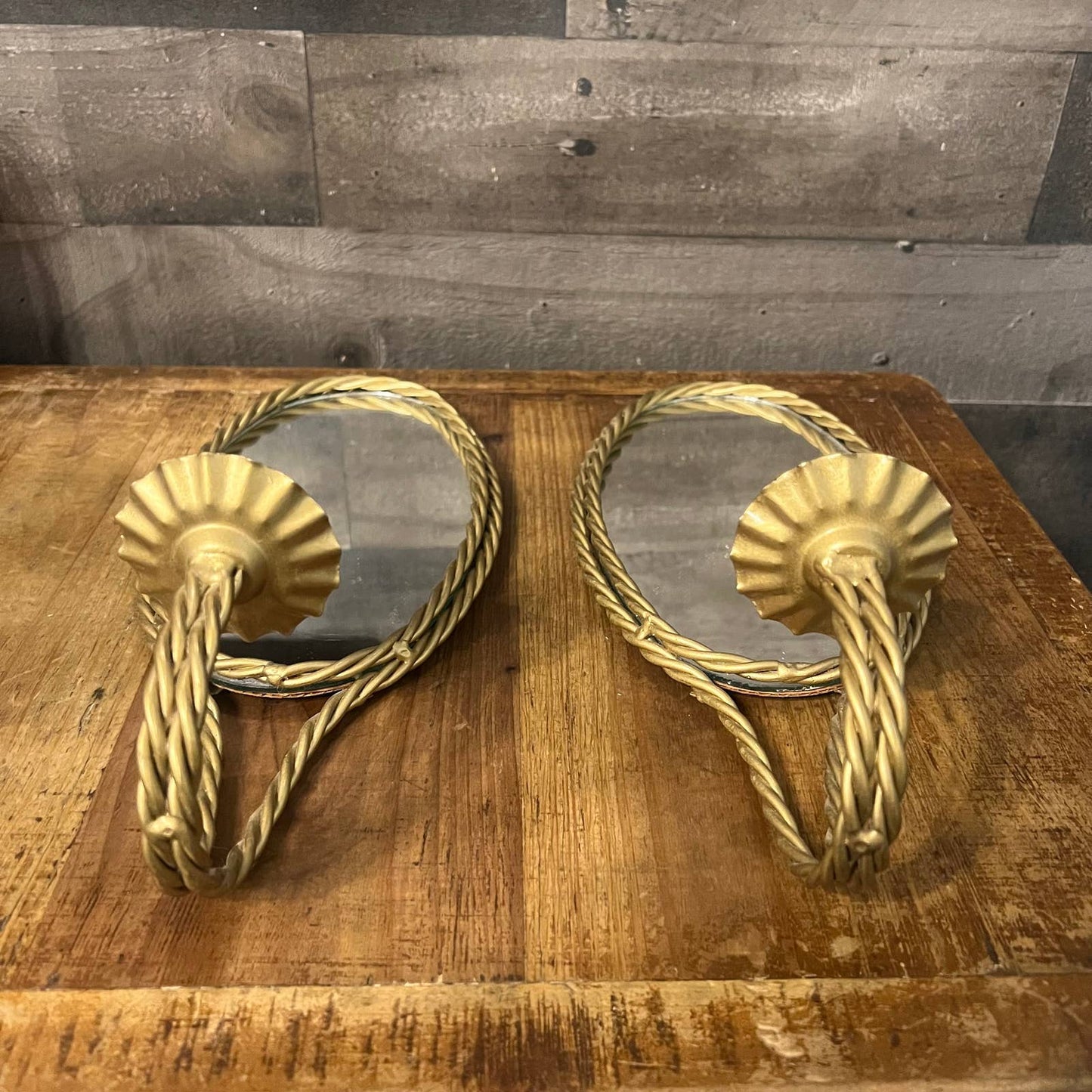 Vintage pair of gold braid mirrored candlestick wall sconces