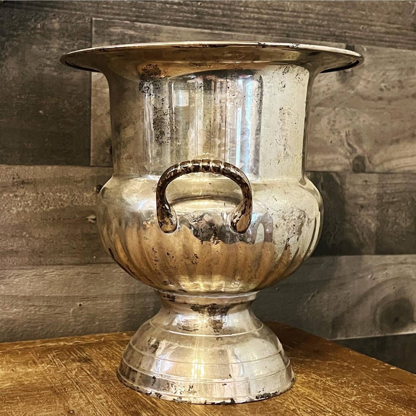Vintage silver toned handled champagne / wine bottle chiller on a pedestal