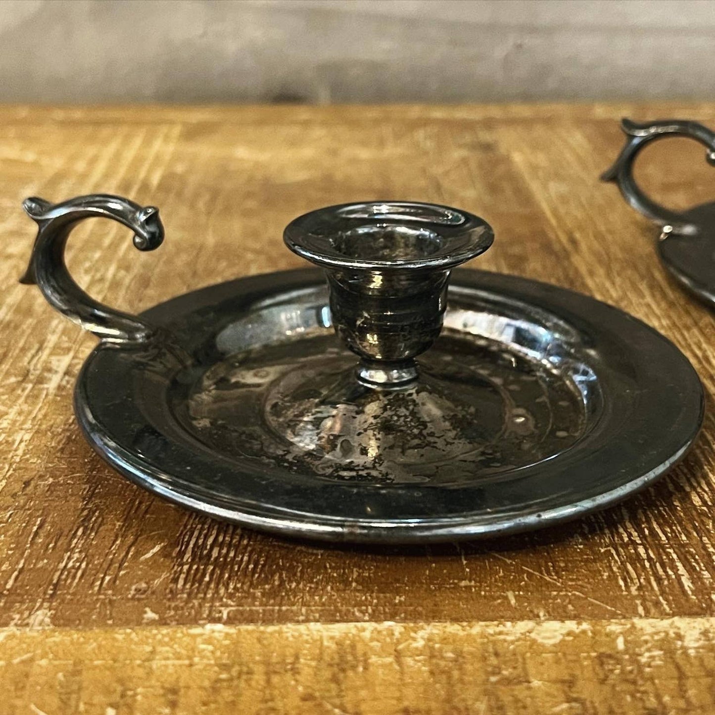 Vintage pair of aged silver tone candlestick holders - chamberstick