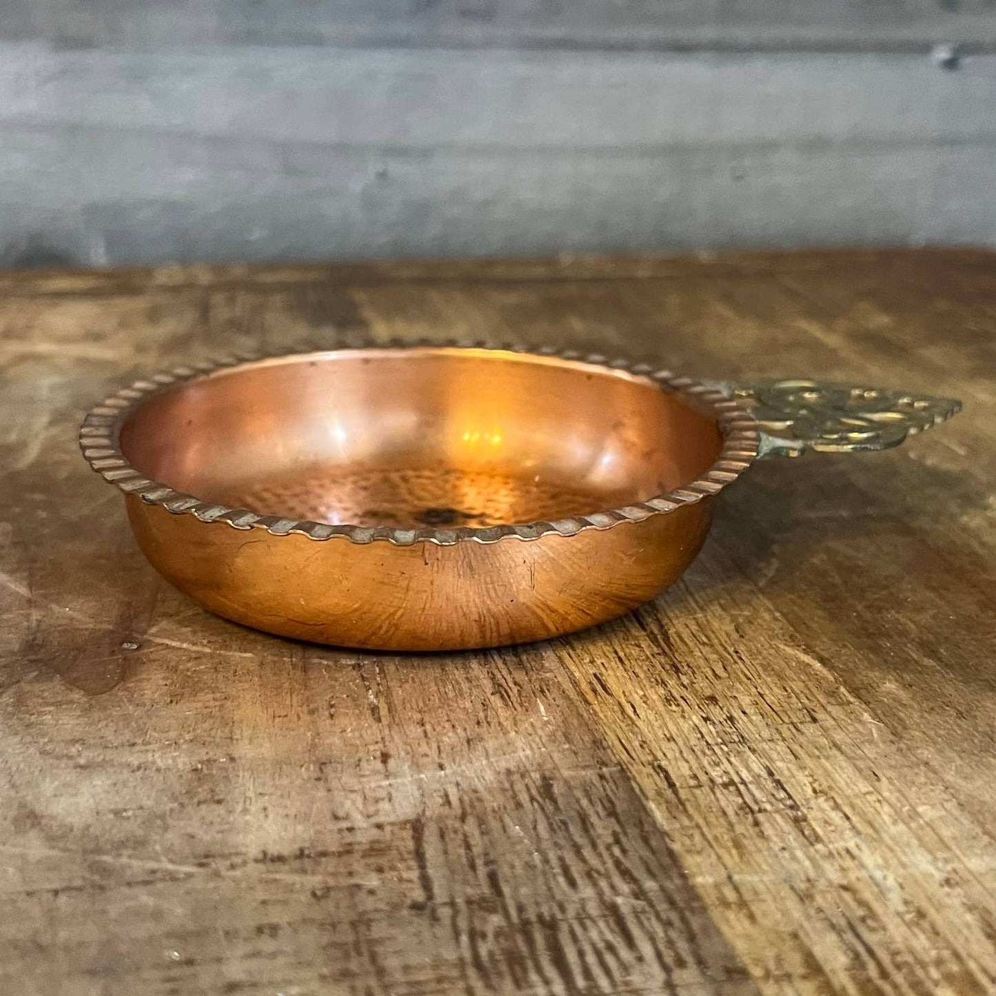 Vintage hammered copper trinket tray with brass handle