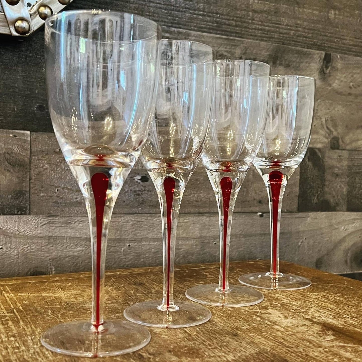Set of 4 red teardrop long stem clear glass wine glasses