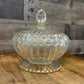 Clear Glass Footed Ribbed Lidded Candy Dish with Aged Gold Rim Base