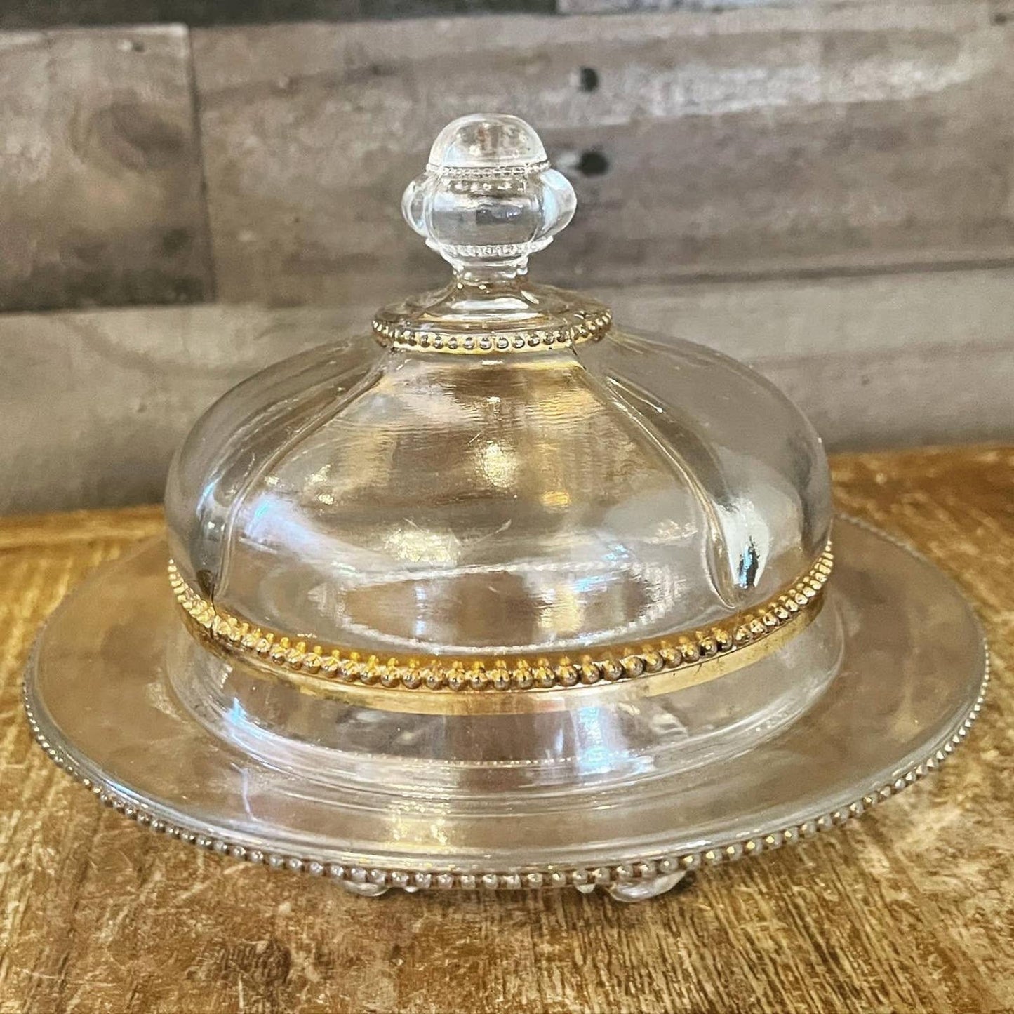 Vintage Victorian style footed clear glass and gold butter dome