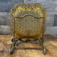 Vintage amber glass LG Wright daisy and button pattern ashtray