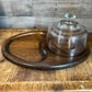 Vintage oval wooden charcuterie board with clear glass dome