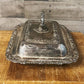 Ornate silver plated rounded rectangle serving dish with handled lid