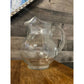 Clear glass bubbly handled beverage pitcher