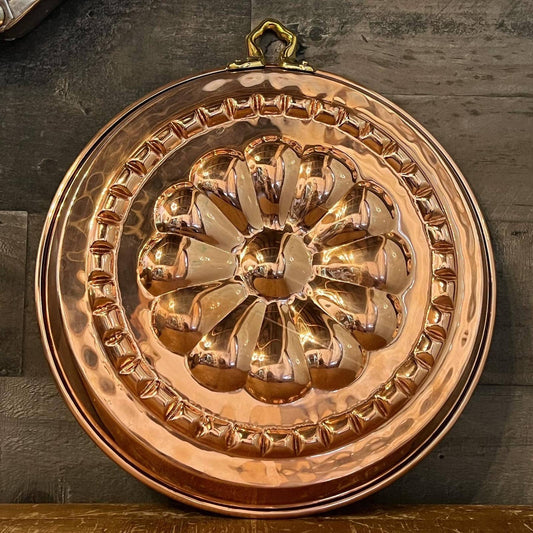 Shiny copper and chrome flower motif round pan with brass hook handle