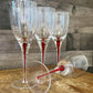 Set of 4 red teardrop long stem clear glass wine glasses