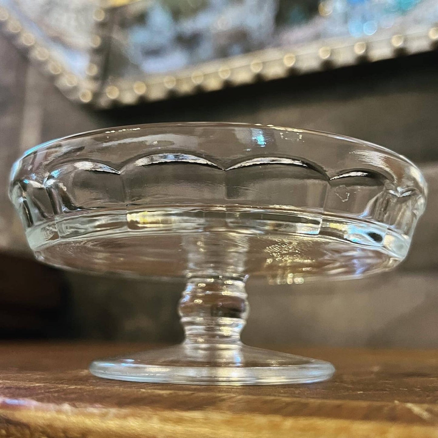 Round shallow clear glass thumbprint pattern pedestal dishes