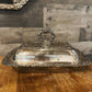 Ornate silver plated rounded rectangle serving dish with handled lid