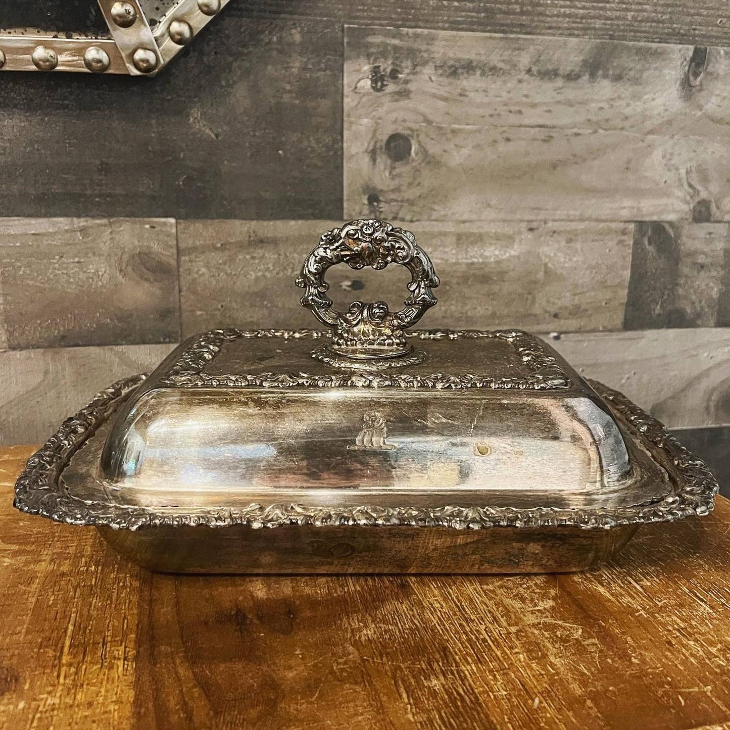 Ornate silver plated rounded rectangle serving dish with handled lid