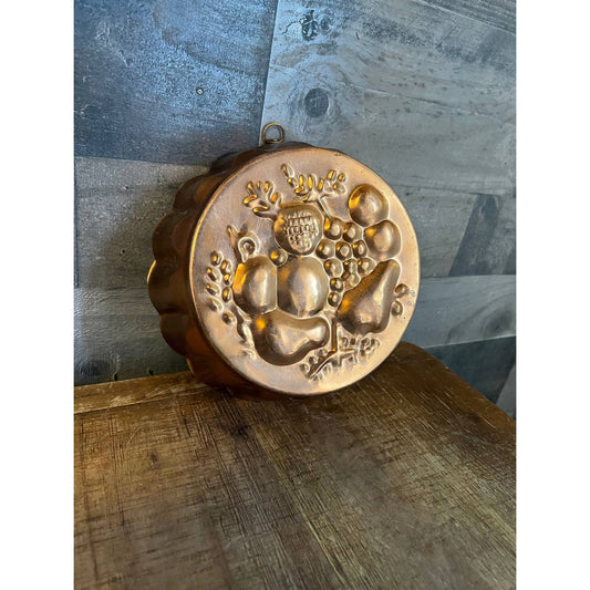 Vintage round copper and brass fruit mold