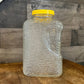 Anchor Hocking Soreno pattern clear glass refrigerator jar with yellow lid