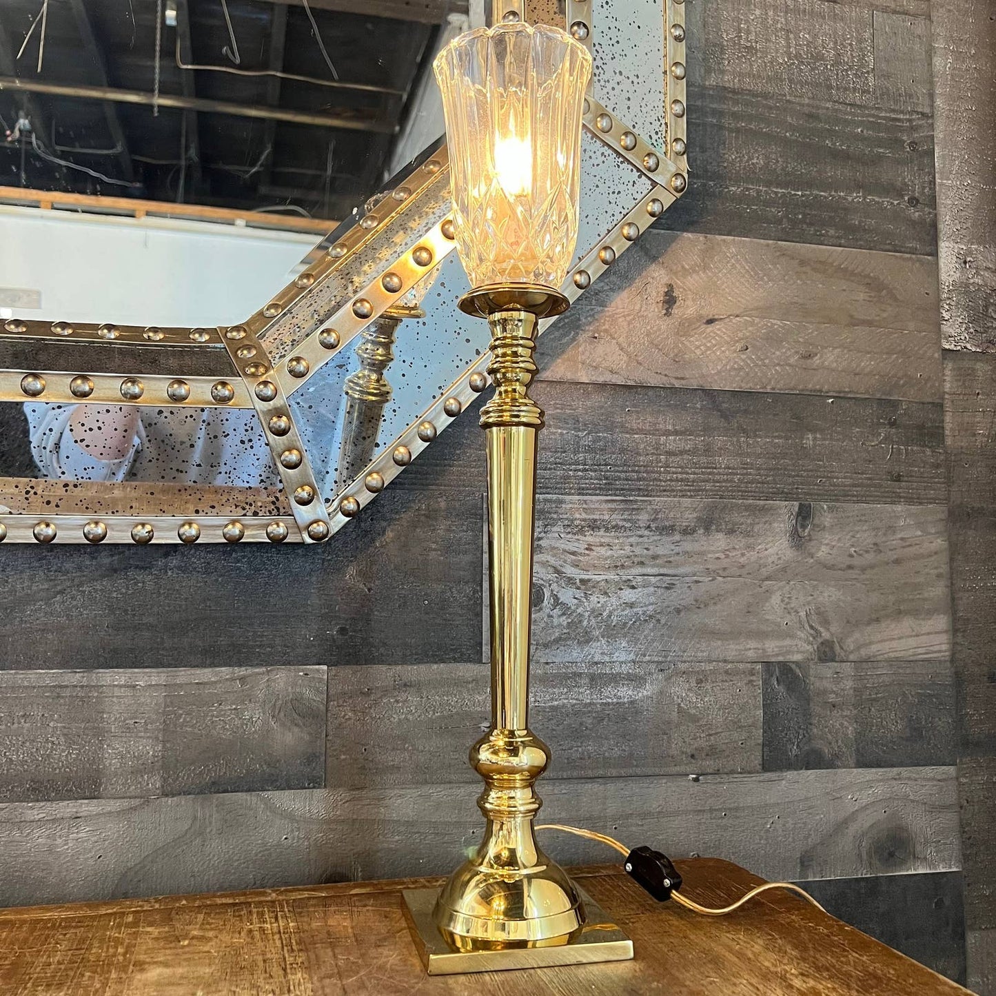 Tall brass candlestick lamp with crystal shade
