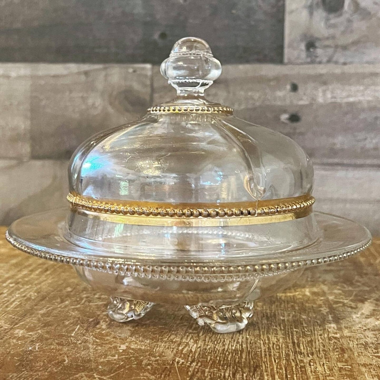 Vintage Victorian style footed clear glass and gold butter dome