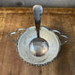 Vintage silver plated basket shaped footed sugar bowl with scalloped handle and spoon