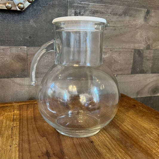 Vintage clear glass pitcher with white plastic lid