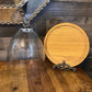 Tall glass dome with round wood serving board