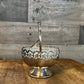 Vintage silver plated basket shaped footed sugar bowl with scalloped handle and spoon