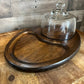 Vintage oval wooden charcuterie board with clear glass dome