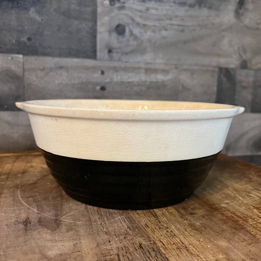 Vintage Universal Potteries Inc black and cream bowl