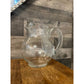 Clear glass bubbly handled beverage pitcher