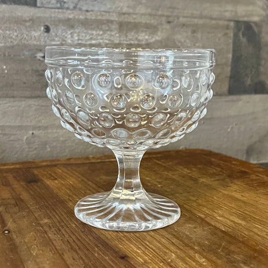 Clear glass hobnail footed candy dish