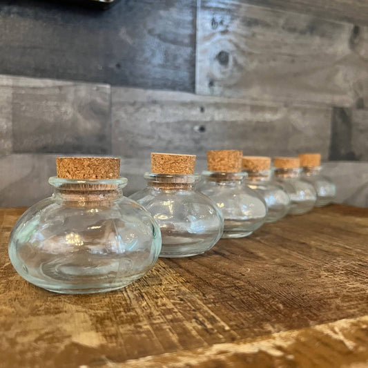 6 small clear glass round bottles with cork lids - apothecary bottles