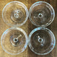 Round shallow clear glass thumbprint pattern pedestal dishes