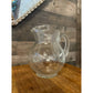 Clear glass bubbly handled beverage pitcher