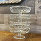 Round shallow clear glass thumbprint pattern pedestal dishes