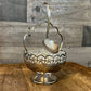 Vintage silver plated basket shaped footed sugar bowl with scalloped handle and spoon